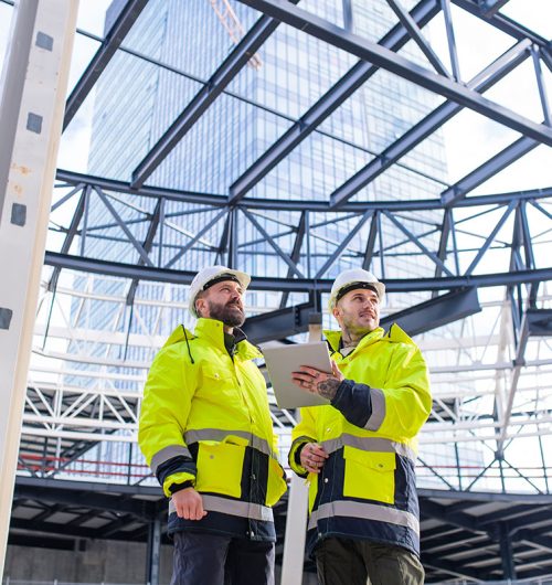 men-engineers-standing-outdoors-on-construction-si-small.jpg